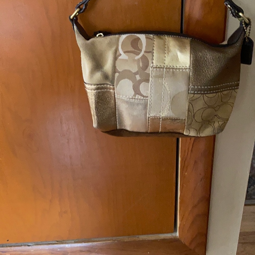 Coach Gold Small Purse .